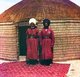 Turkmenistan: Two Turkmen soldiers outside a yurt standing on a Turkoman carpet, c. 1908
