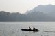 Thailand: Monks on their early morning almsround on the lake at the Mae Ngat Dam, near Chiang Mai, northern Thailand