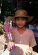 Vietnam: A young girl selling incense